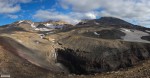 Вид на вулкан Мутновский и водопад в каньоне Опасный
